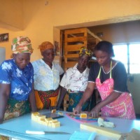 Members of the co-operative prepare orders. Photo credit: Tickbird